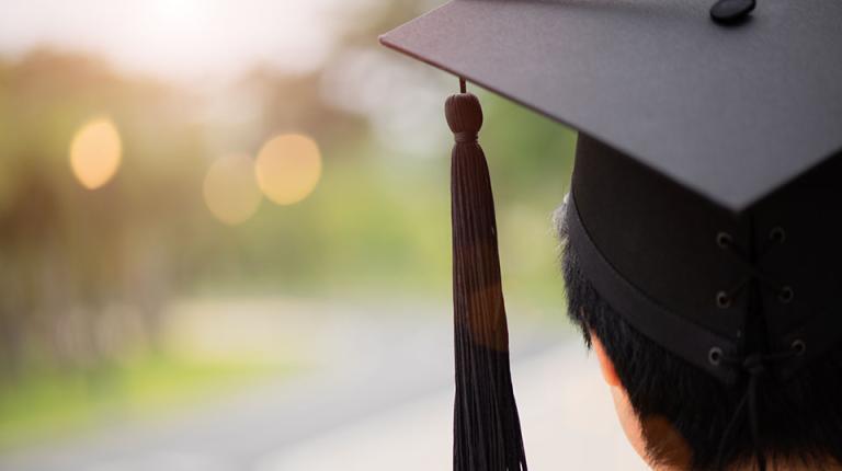  Close up of a graduation hat on student's head